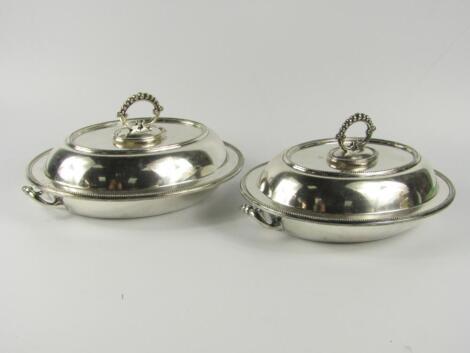 A pair of silver plated oval entree dishes by Walker & Hall