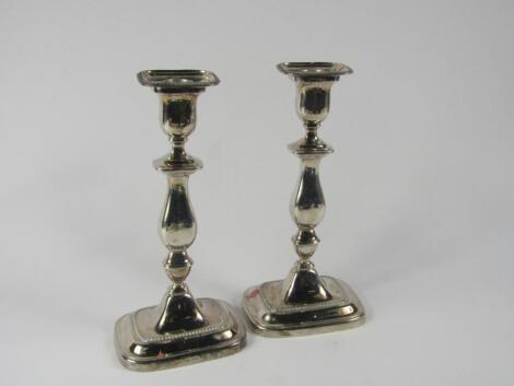 A pair of Elizabeth II silver candlesticks