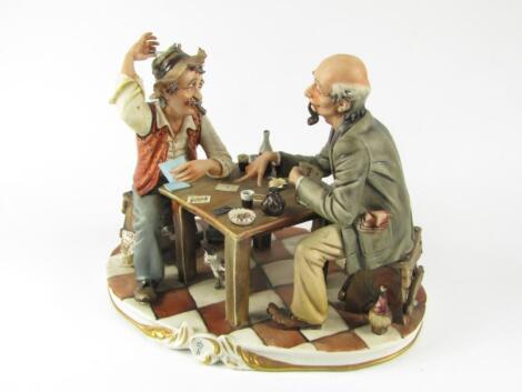 A Capodimonte Porcelain figure group of two card players