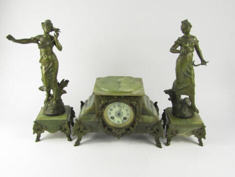 A French onyx and metal clock garniture