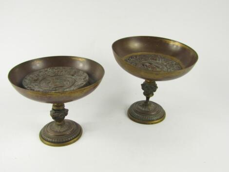 A pair of French late 19thC bronze and brass pedestal dishes