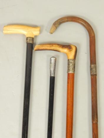 A Victorian ebony walking stick with an ivory handle