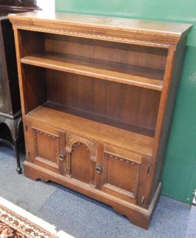 An oak cupboard bookcase