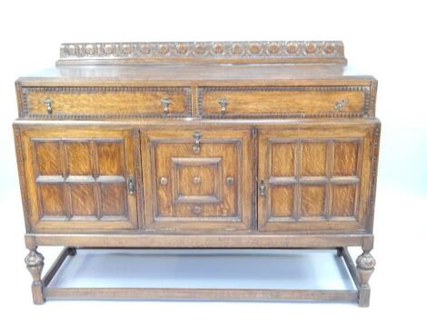 An early 20thC oak sideboard