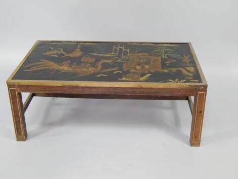 An chinoiserie ebony and brass mounted rectangular occasional table