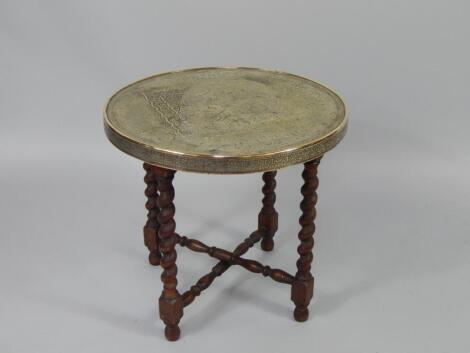 A Persian brass and oak folding occasional table