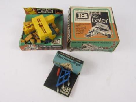 Various Britains boxed implements