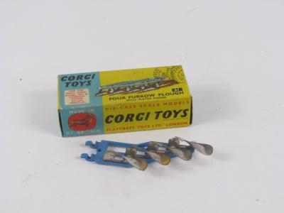 A Corgi Toys four furrow plough