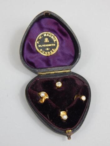 A cased stud set