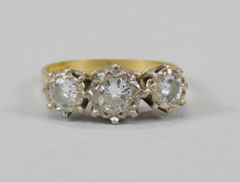 An 18ct gold three stone diamond ring