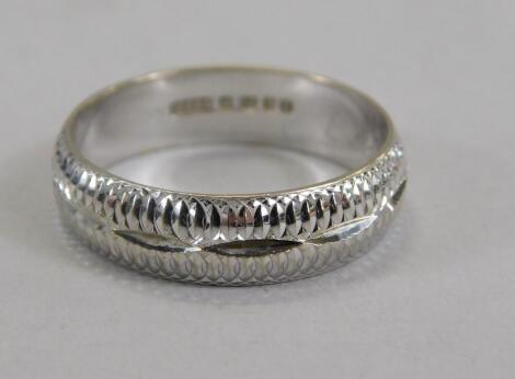 An 18ct white gold wedding band