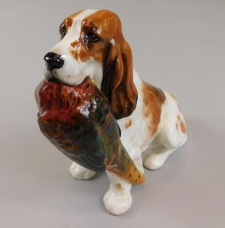 A Royal Doulton figure of a dog with pheasant in his mouth