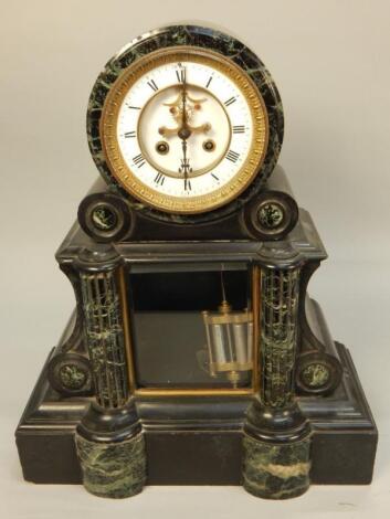 A Victorian black slate and marble mantel clock