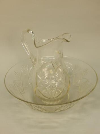 A large cut glass wash bowl and wash jug