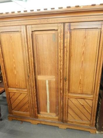 A Victorian pitch pine Gothic style wardrobe