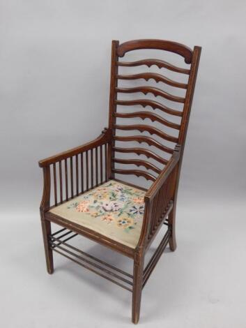 A Victorian mahogany and satinwood banded open armchair