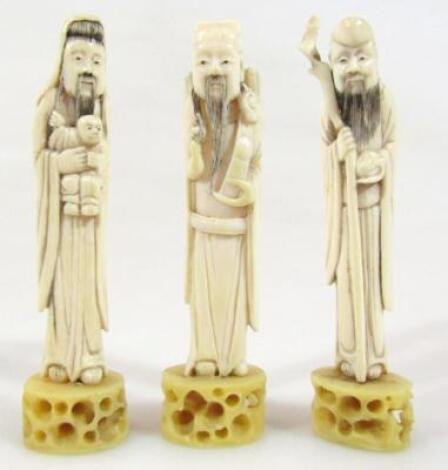 A set of three 19thC ivory figures of sages