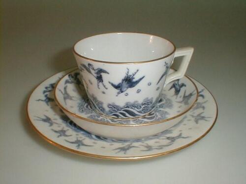 A Minton porcelain trio comprising: cup