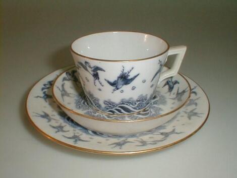 A Minton porcelain trio comprising: cup