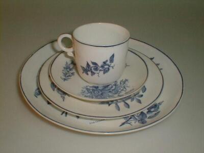 A Royal Worcester porcelain trio comprising coffee cup