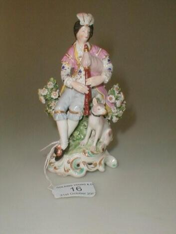 A Continental porcelain figure of a youth playing bagpipes