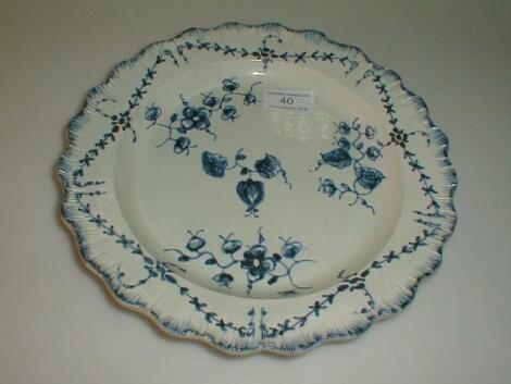A pearl ware plate, painted in underglaze blue with simple flower and leaf