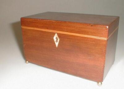 A 19thC mahogany tea caddy of oblong form banded with satinwood