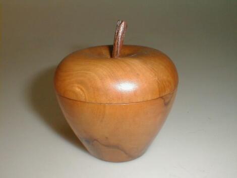 A fruitwood caddy, modelled as a pear, the interior loose lid with turned finial 3£" high