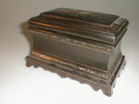 A 19thC papier mache tea caddy of oblong waisted form