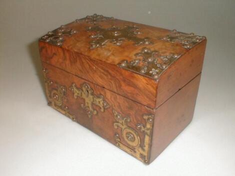 A 19thC burr walnut tea caddy of oblong form