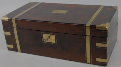 An early 19thC flame mahogany and brass bound campaign writing box