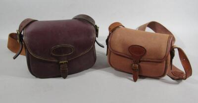 Two shoulder cartridge bags.