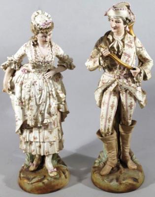 A pair of 19thC German bisque porcelain figures