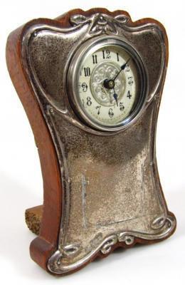 An Edwardian silver Art Nouveau design mantel clock
