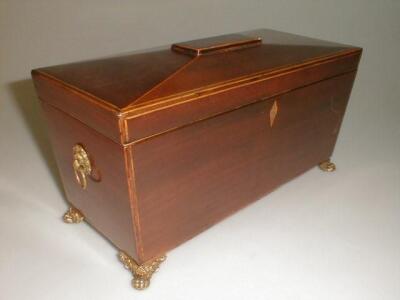 A 19thC mahogany tea caddy of sarcophagus form with satinwood and harewood banding