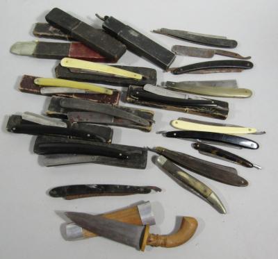 A small collection of antique cut throat razors