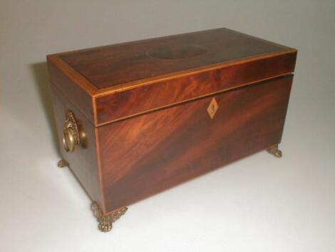 A 19thC figured mahogany tea caddy of oblong form