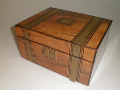 A 19thC rosewood writing slope having ebony and boxwood stringing and brass banding