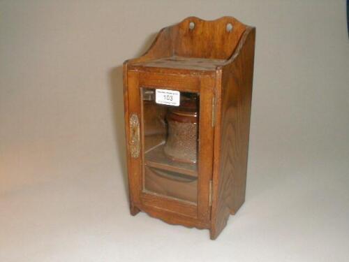 An Edwardian oak smokers cabinet with single glazed door £10-30