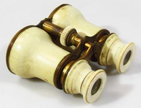 A pair of late 19thC/early 20thC ivory framed binoculars