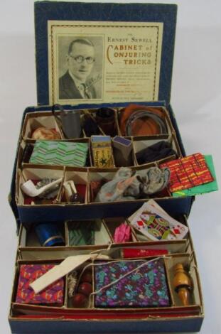 An early 20thC Ernest Sewell Cabinet of Conjuring Tricks child's magic set