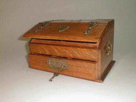 An early 20thC oak table cabinet