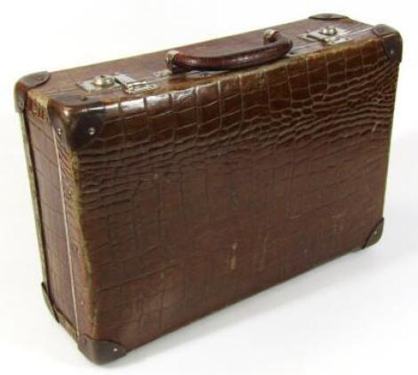 A 20thC faux crocodile skin leather suitcase