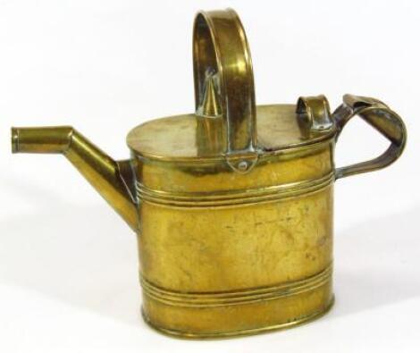 An Edwardian brass watering can