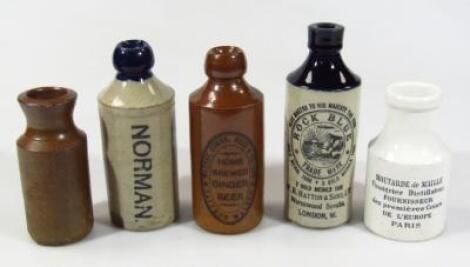 Various stoneware advertising bottles etc.