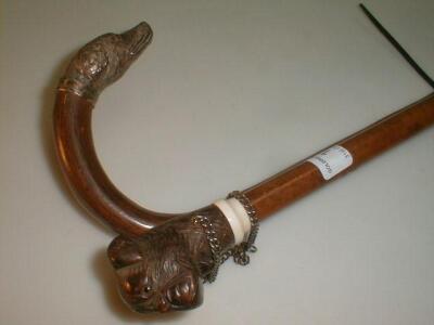 A walking stick, the canine handle modelled as a boxer dogs head, with