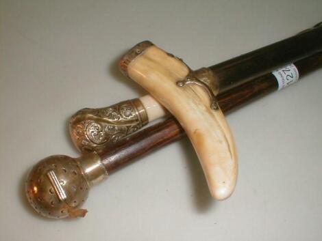 A rootwood stick with ivory handle