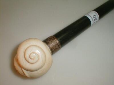 An ebony walking stick with an ivory knob handle modelled as a snail