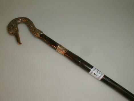 A walking cane; the silver handle modelled as a flamingo head