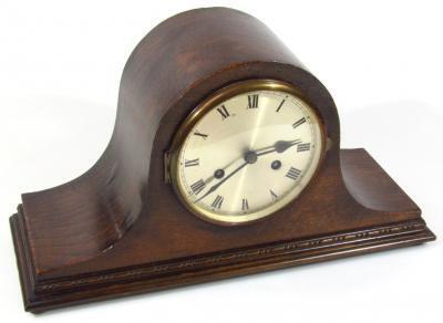 An early 20thC oak cased Napoleon hat mantel clock